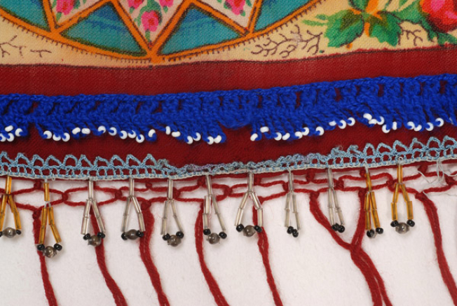 Detail of the applique decoration with bought tanteles (laces)