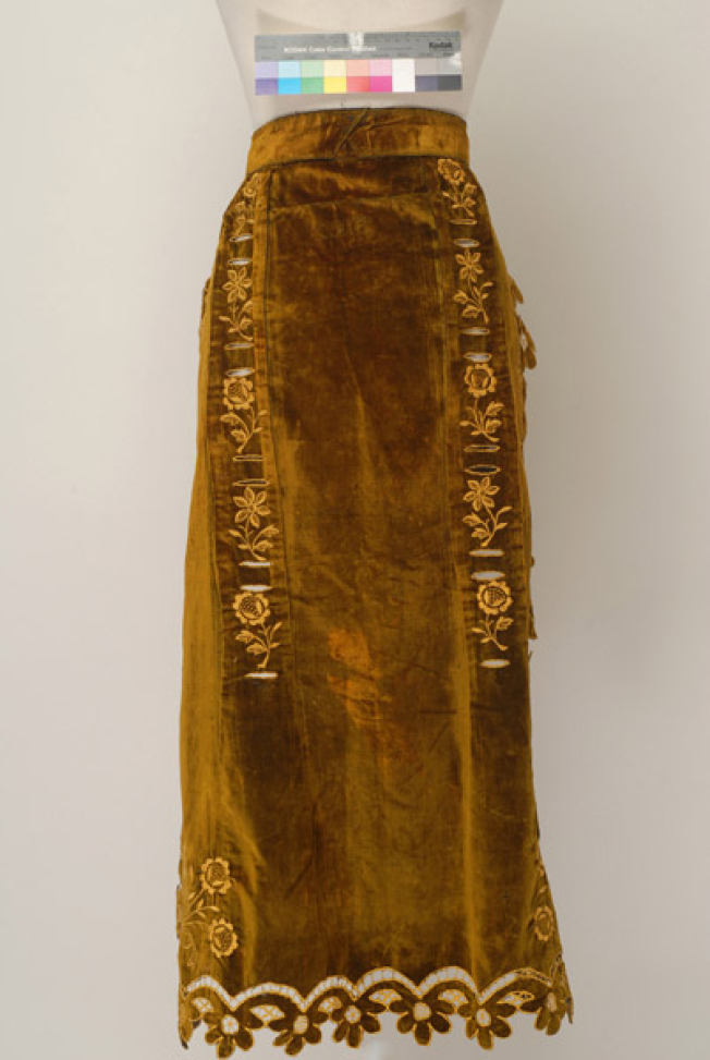 Velvet apron with machine-made embroidery