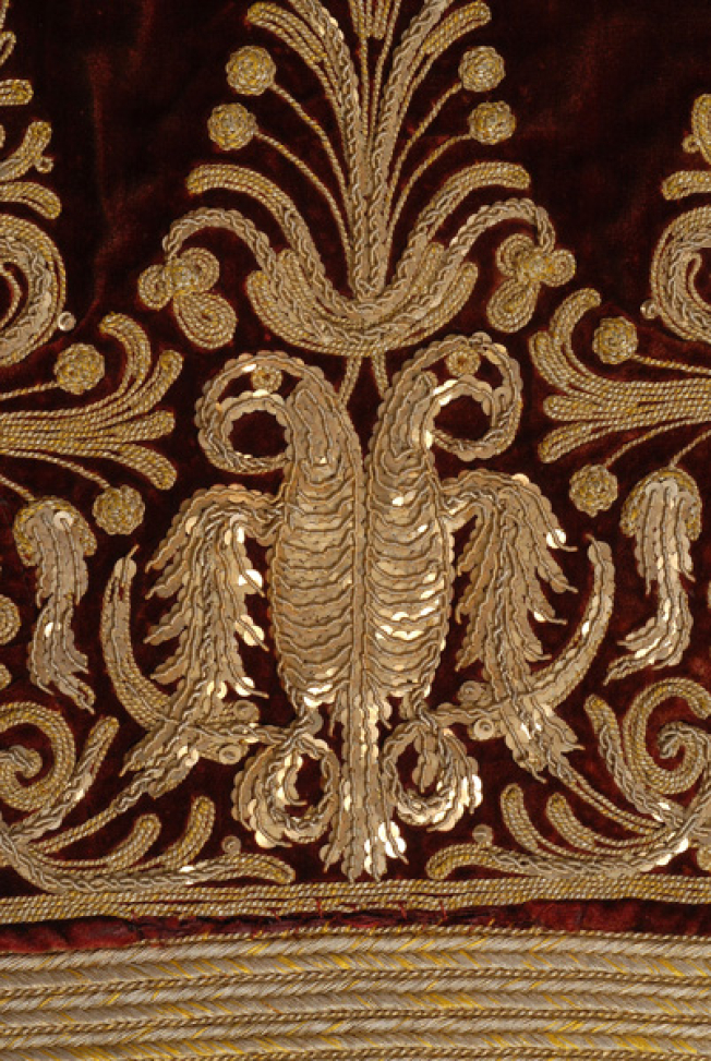 Detail of the terzidiki decoration at the bottom of the back, double-headed eagle.