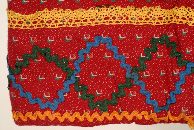 Detail of the applique decoration at the hem of the sleeve 