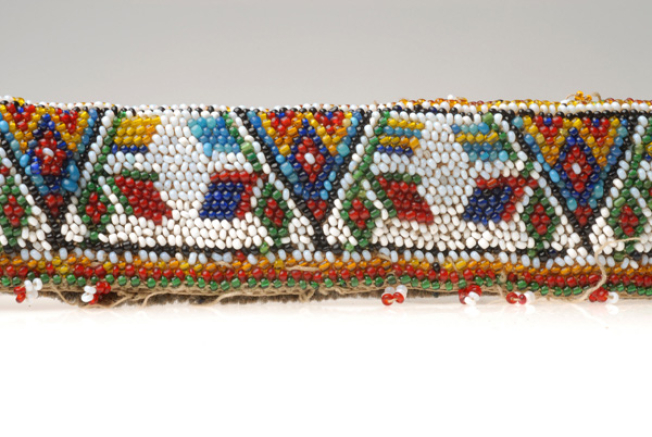 Detail of the decoration with multicoloured beaded stylized decoration