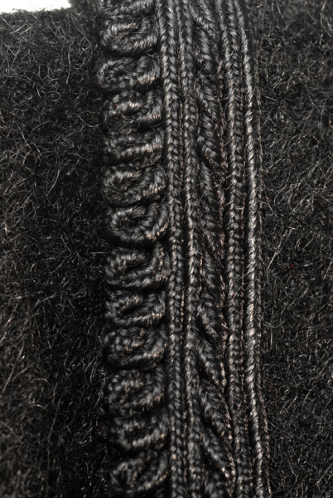 Sleeve, detail of the applique decoration with plain-coloured and loops 