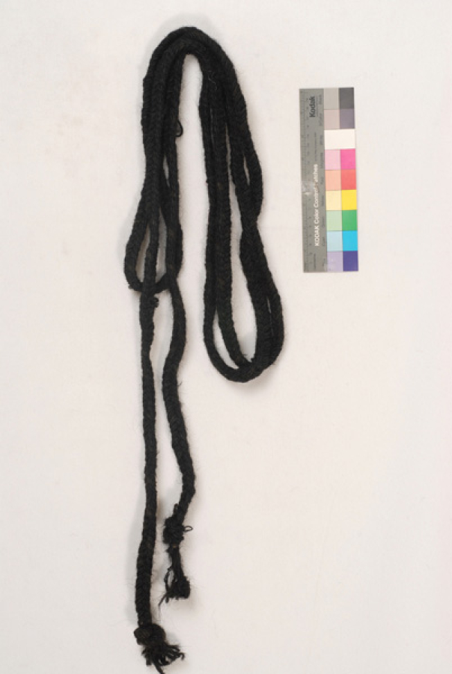 Knitted black woollen cordon, accessory of the women's costume from Alona