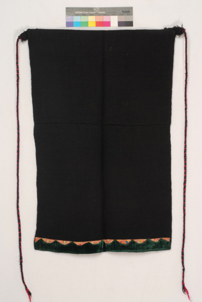 Woven apron made of black woollen dimity fabric, accessory of the women's costume from Psarades (Prespes)
