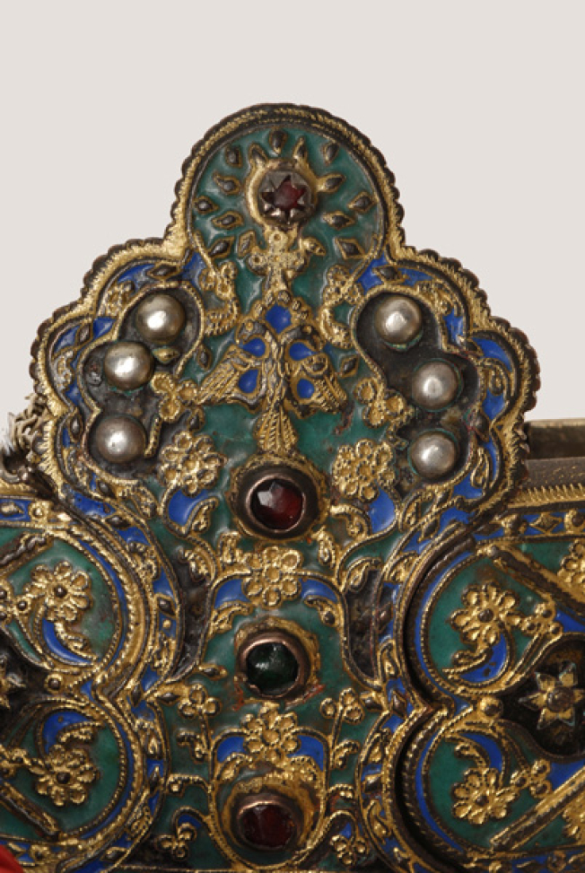Detail of the decoration with variegated enamel, colouful stones, flowers and a double-headed eagle at the top of the buckle