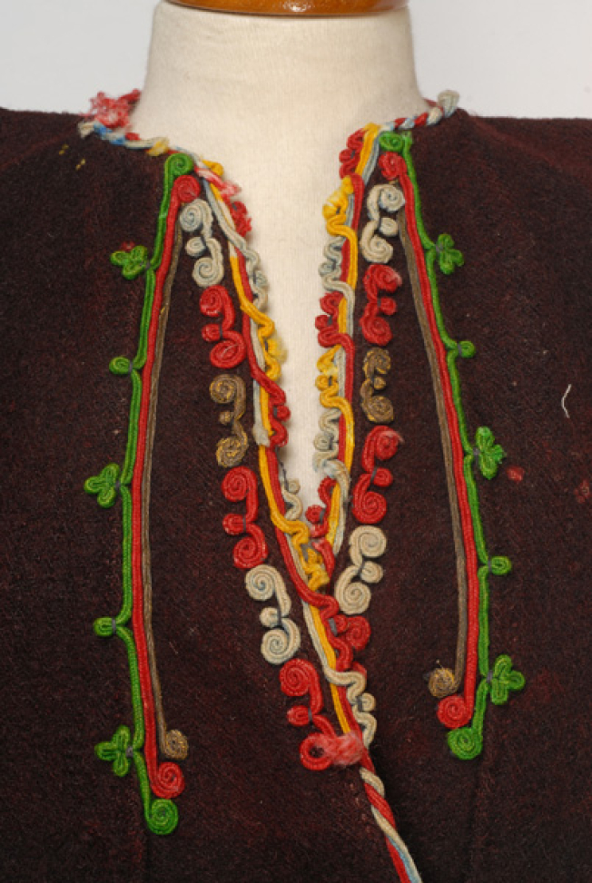 Detail of the applique decoration at the chest