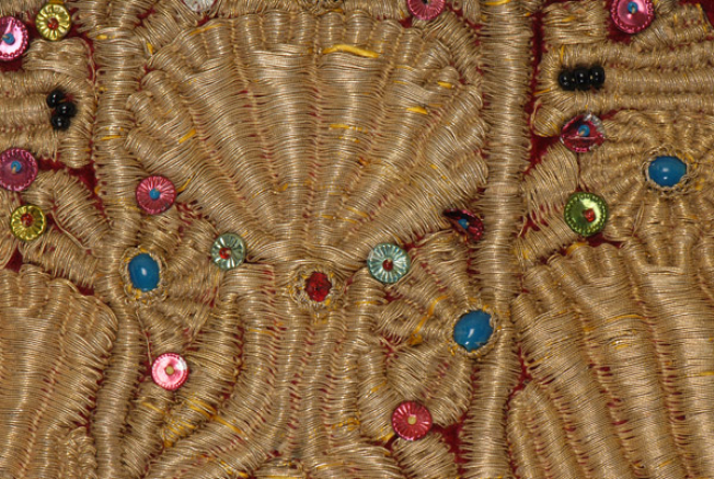 Detail of the decoration with applique elements (multicoloured spangles, black beads)