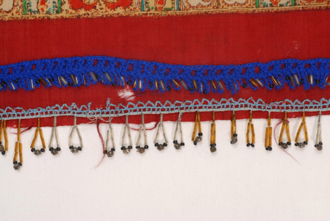 Detail of the applique decoration with bought tanteles (laces)