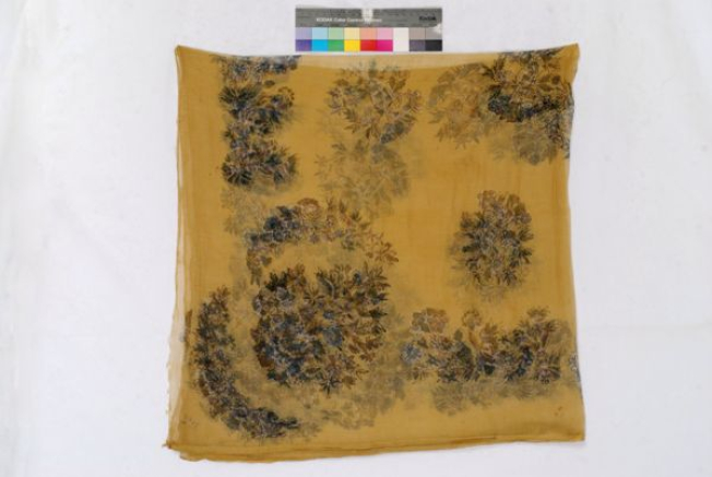 Yellow printed head kerchief with leafy scrolls and flowers