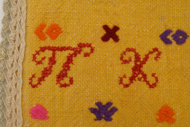 Embroidered monogram on the apron