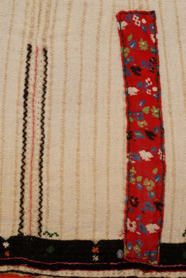 Detail of the decoration at the border, applique calico and mertza (embroidered joint) with fine embroidery on either side