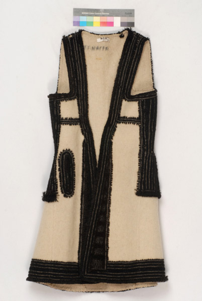 Sigouna made of whitish fullen wool fabric embroidered with black wool strimmata