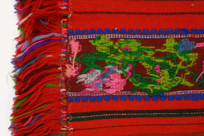 Loom embroidery and woollen fringes