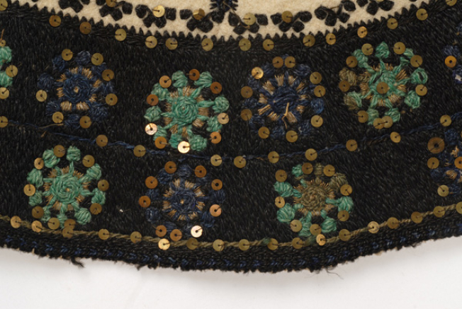 Flowers with gold thread and spangles at the edging of the bottom