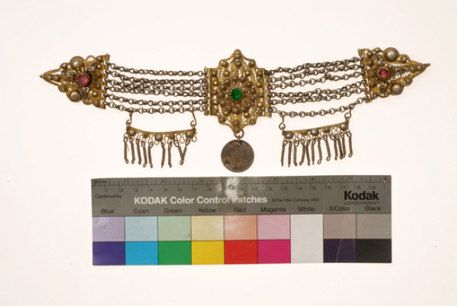Vastaki, gold plated wiry torso ornament, decorated with coloured glass beads