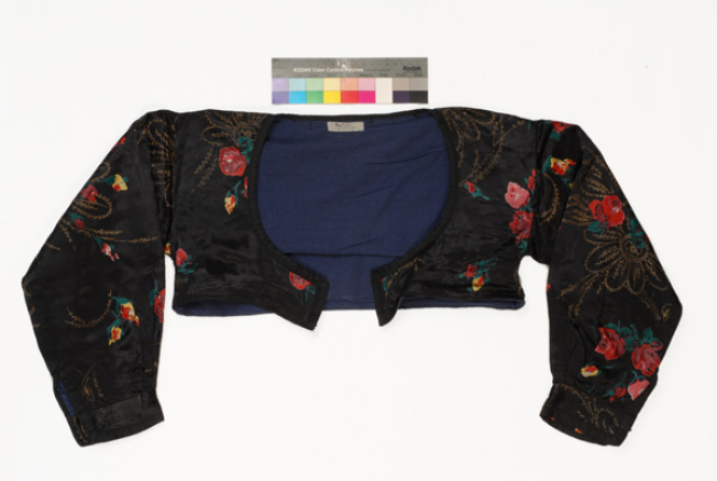 Koutsomango, short sleeved jacket made from printed satin fabric.