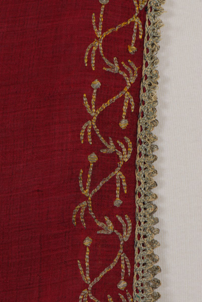 Sleeve, detail ath the decoration of the heel and the edge 
