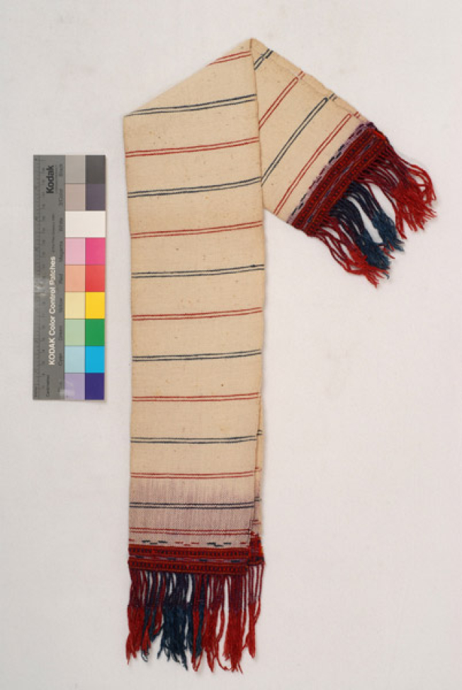 Karpa, white cotton woven towel, with embellished multicoloured patterns at the two edges and fringed edge