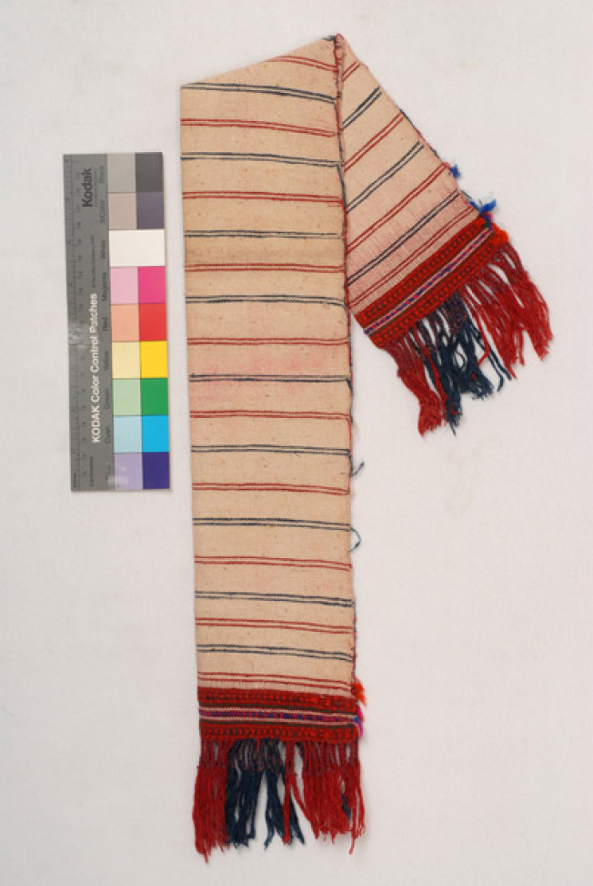 Karpa, white cotton woven towel, with embellished multicoloured patterns at the two edges and fringed edge