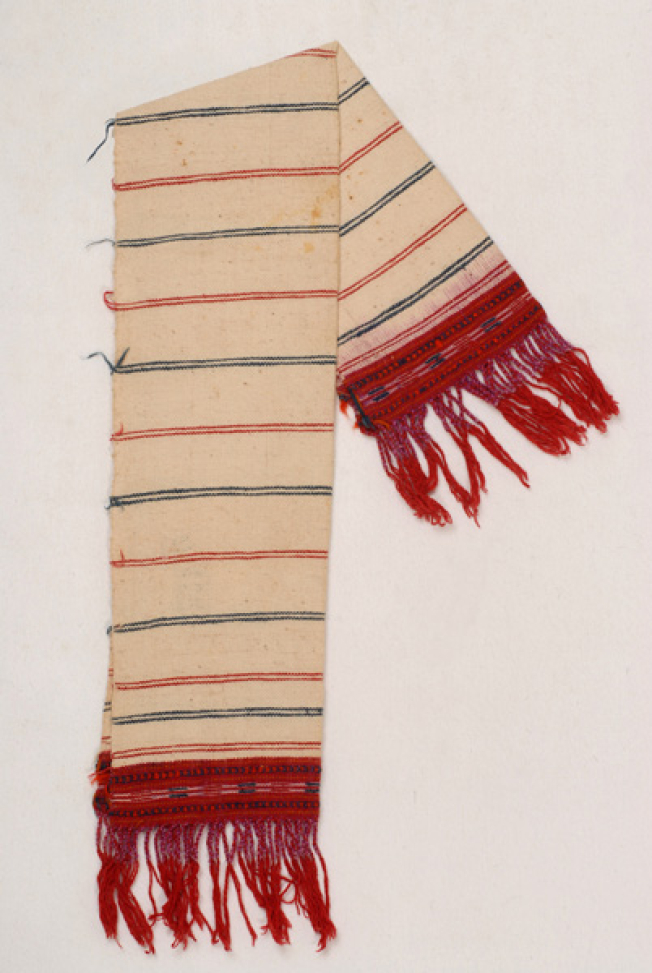 Karpa, white woven towel, with embellished coloured patterns at both sides and fringed edge 