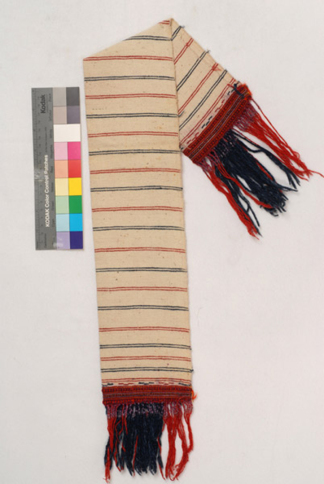 Karpa, white cotton woven towel, with embellished multicoloured patterns at the two edges and fringed edge