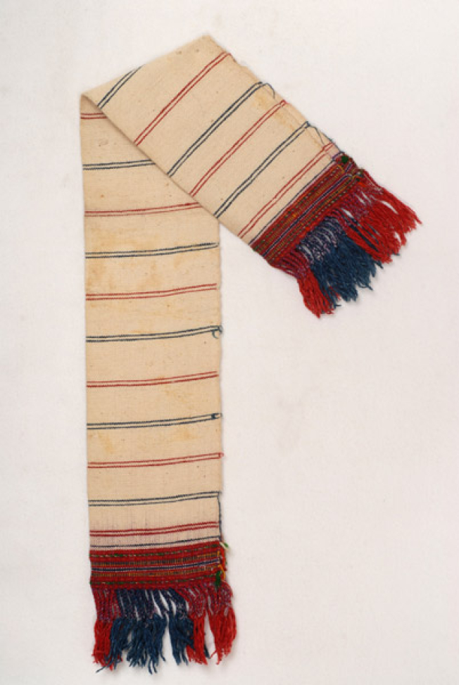 Karpa, white cotton woven towel, with embellished multicoloured patterns at the two edges and fringed edge