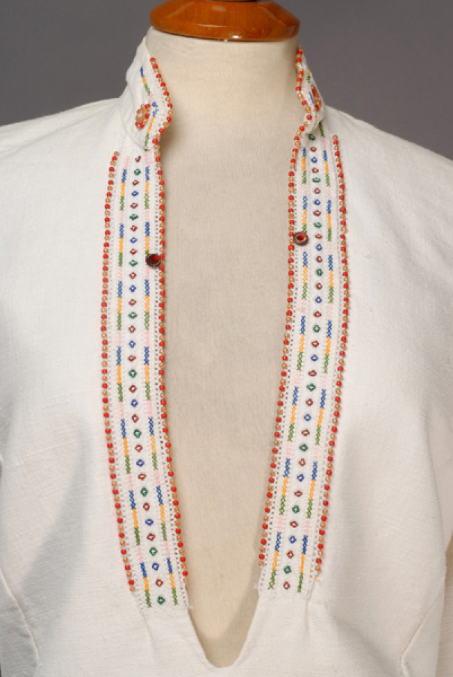 Plastron, detail of the applique and embroidered decoration 