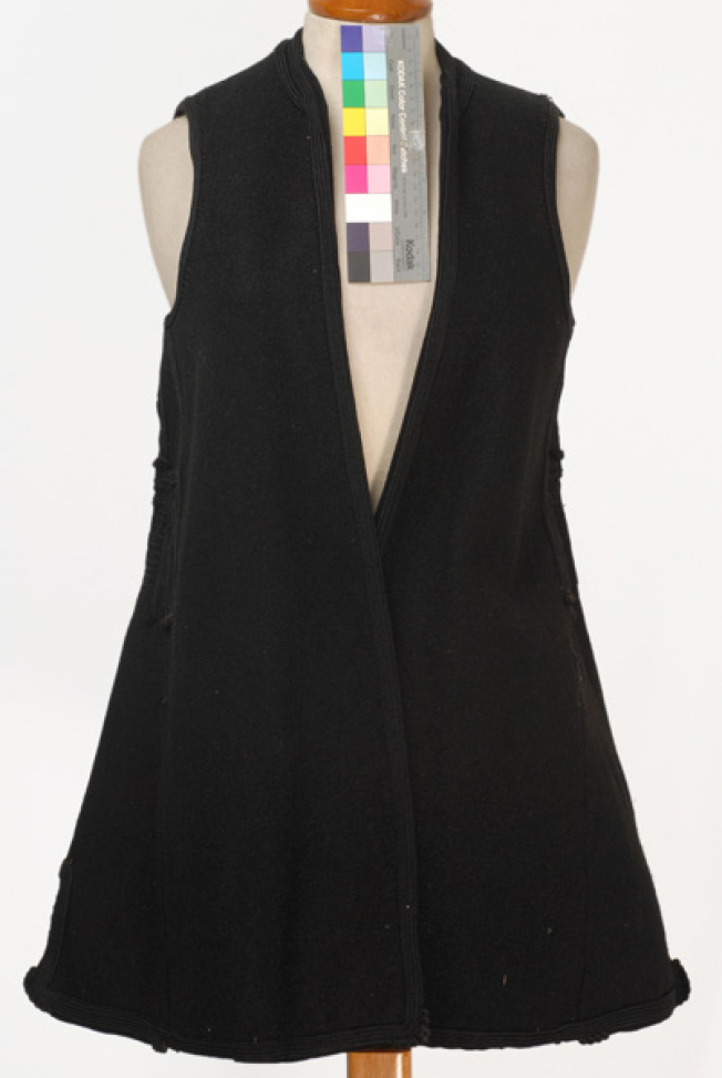 Woollen sigouna, sleeveless overcoat made of saddle blanket decorated with black woollen strimmata and cordons