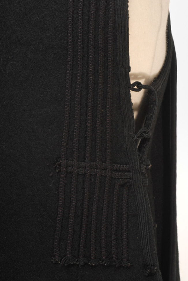 Back panel, applique decoration with black woollen seradia and cordons
