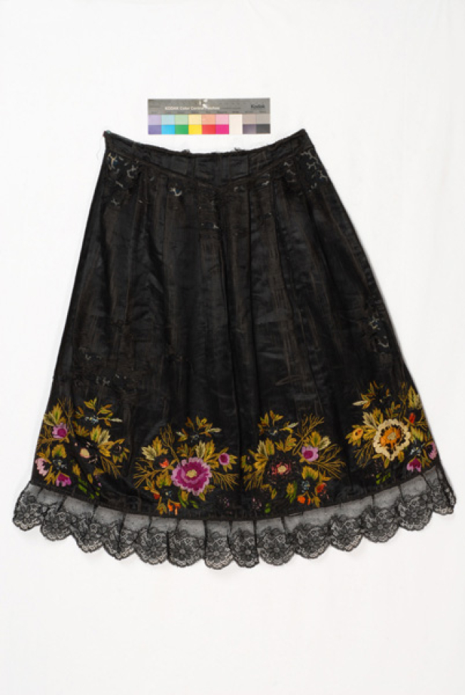 Black satin apron embroidered with multicoloured silk threads