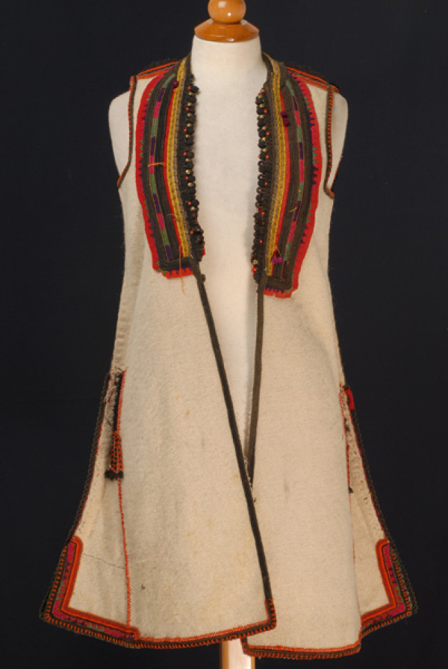 White sigouna, sleeveless overcoat made of saddle blanket decorated with colourful seradia