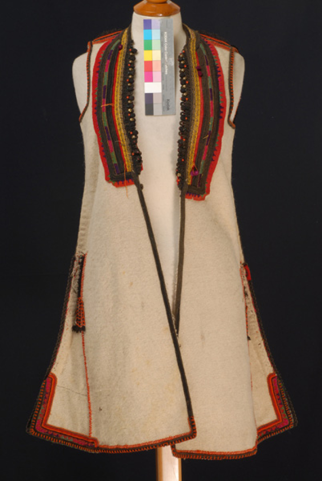 White sigouna, sleeveless overcoat made of saddle blanket decorated with colourful seradia