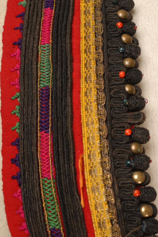 Front panel, detail of the applique decoration