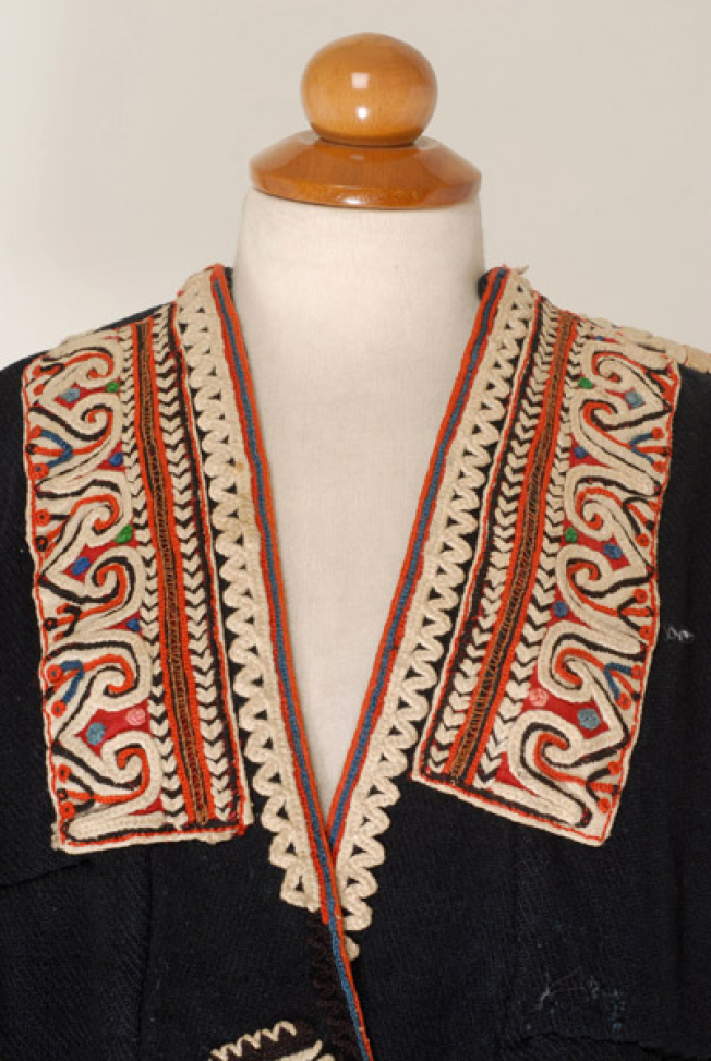 Detail of the decoration at the chest on bouchassi and white cotton woven material