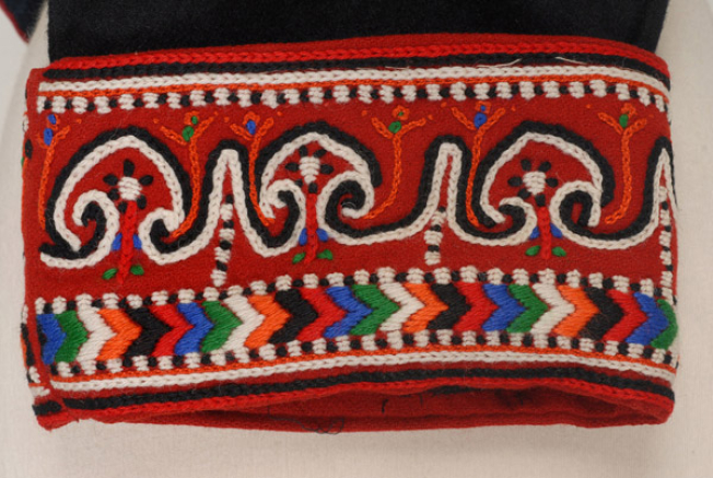 Detail of the sleeve decoration on wool fabric