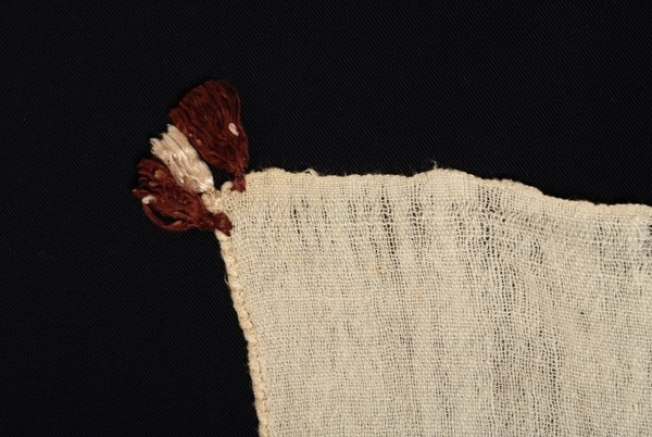 Small tassels at the top corner
