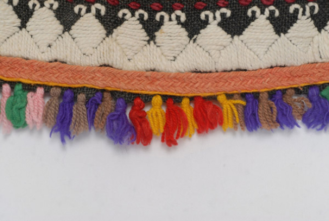 Detail of the decoration, applique woollen gaitani, woollen cord and small fringes made of sayiaki (fullen wool fabric) at the edge