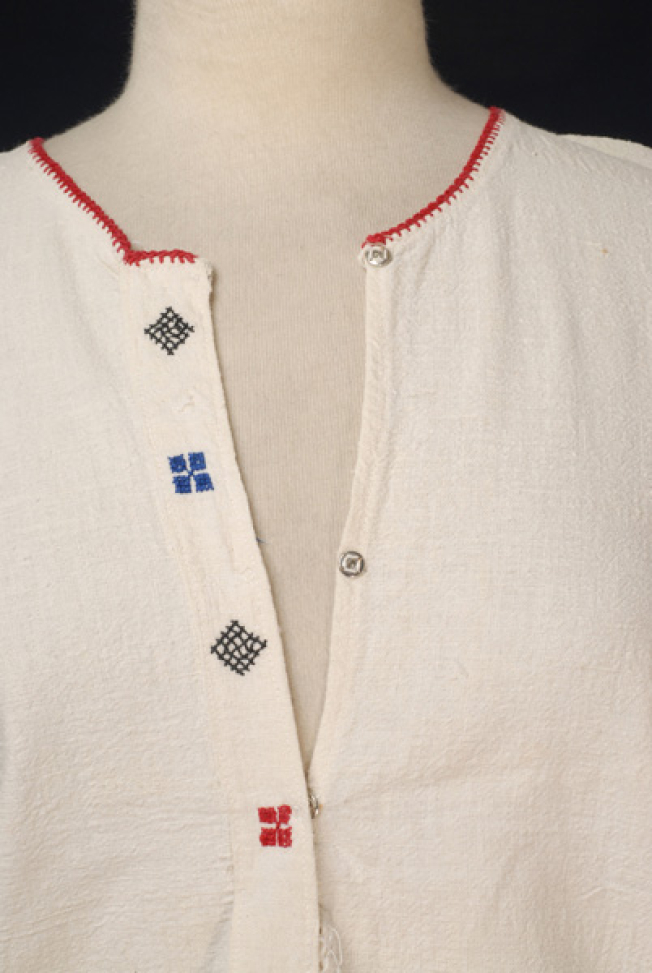 Detail of the embroidered decoration at the chest