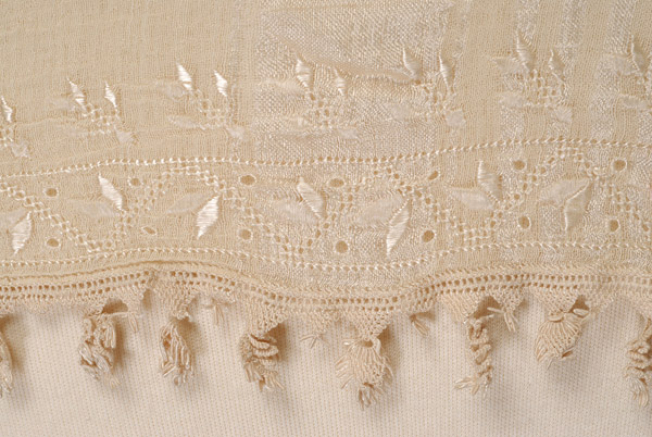 Border, detail of the decoration with flat stitch and silk bibila (crocheted lace)