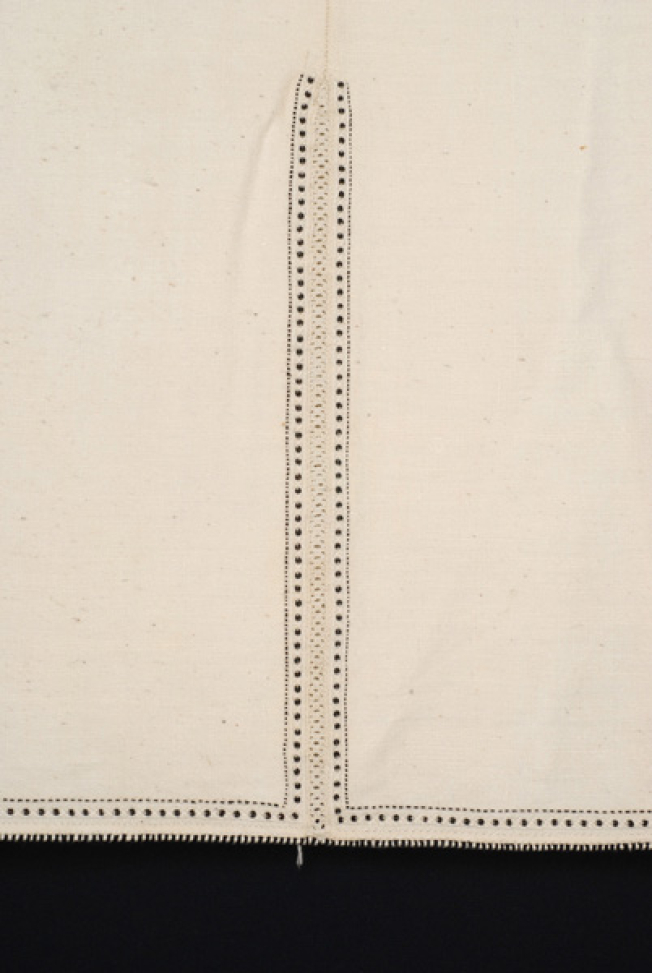 Border, detail of the lacy band of the seam and applique decoration with black beads