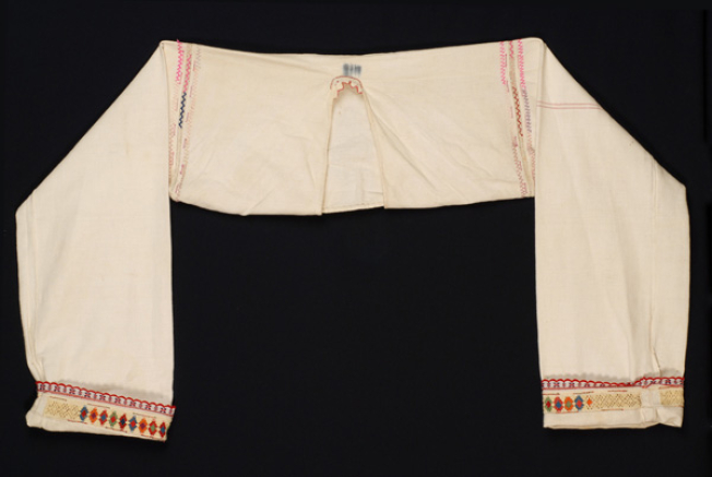 Sleeved bodice made of white cotton fabric of the loom