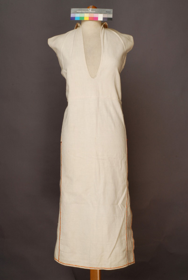 Poukamisa me tis podies, long outer cotton garment with large openings at the right and the left sides