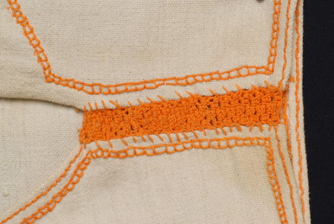 Detail of the seam joint with embroidery needle 