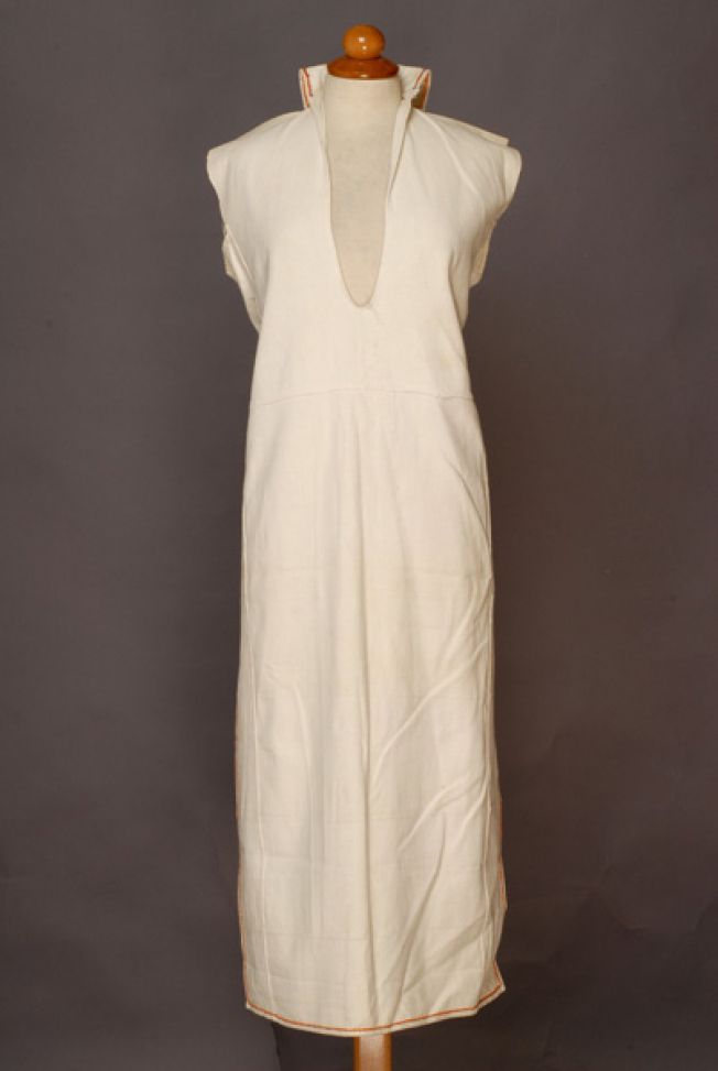 Poukamisa me tis podies, long outer cotton garment with large openings at the right and the left sides