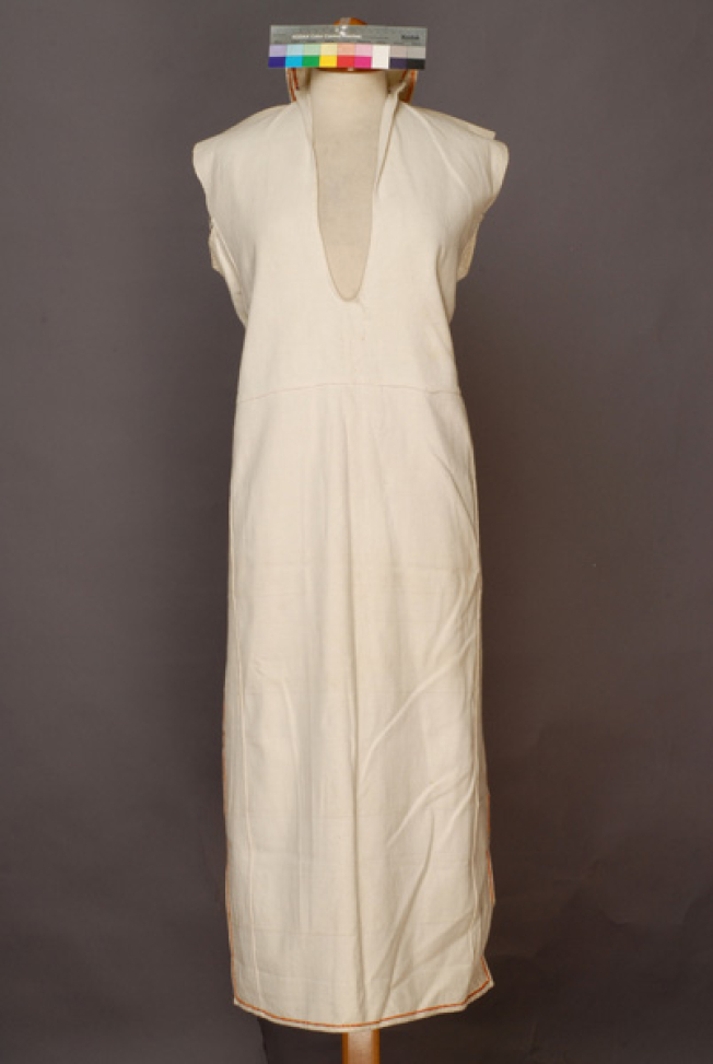 Poukamisa me tis podies, long outer cotton garment with large openings at the right and the left sides