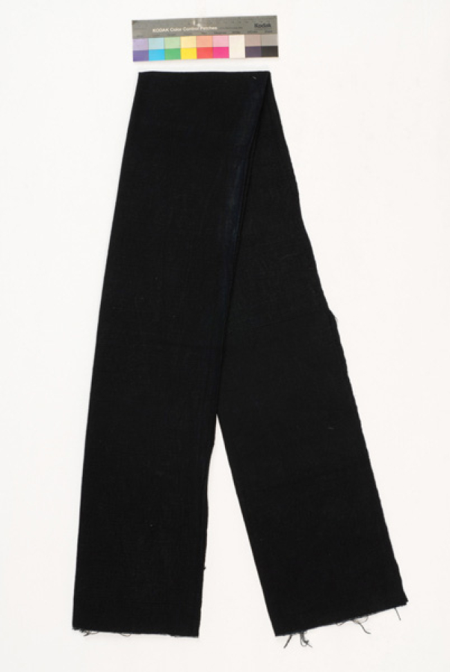 Zounari, woven sash of the loom in dark blue colour, folded back in half