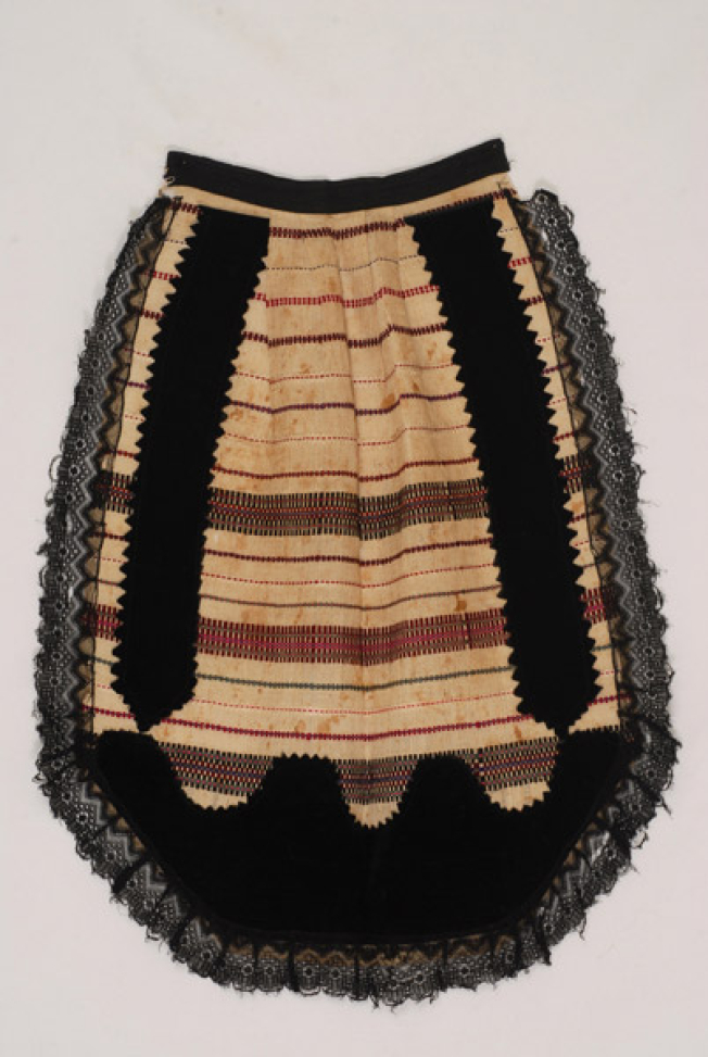 Spathoti woven apron with embellished horizontal stripes. Applique decoration with pieces of velvet and black lace
