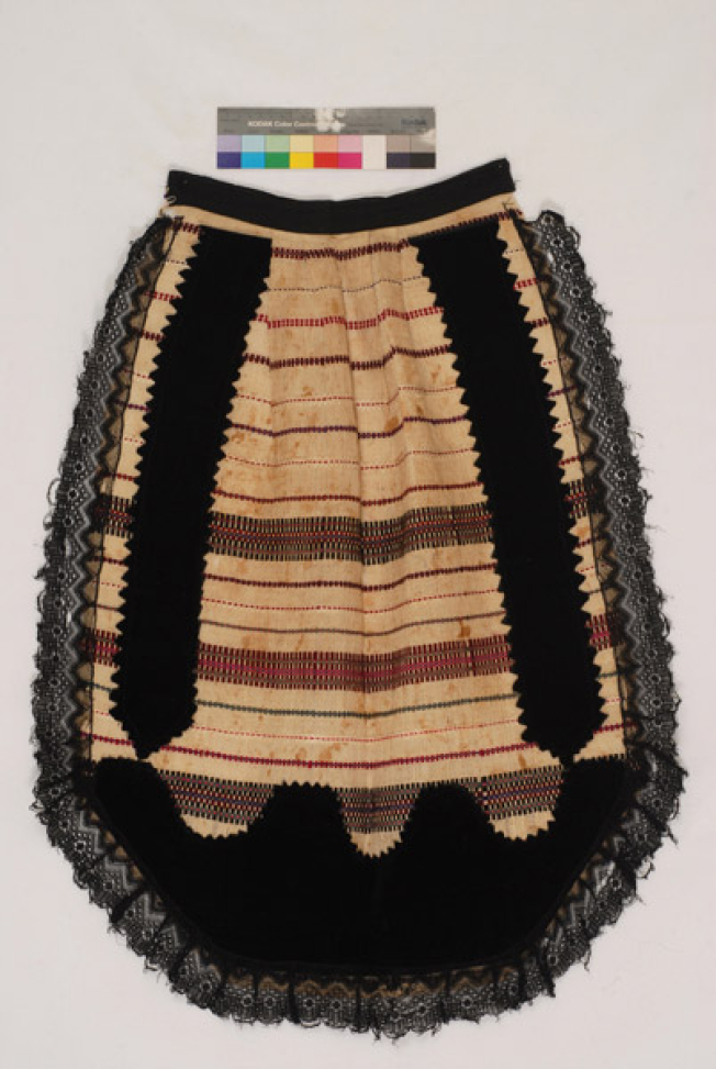 Spathoti woven apron with embellished horizontal stripes. Applique decoration with pieces of velvet and black lace