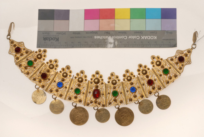 Gilt xelitsi, filigree head ornament decorated with variegated glass stones and gilded coin imitations