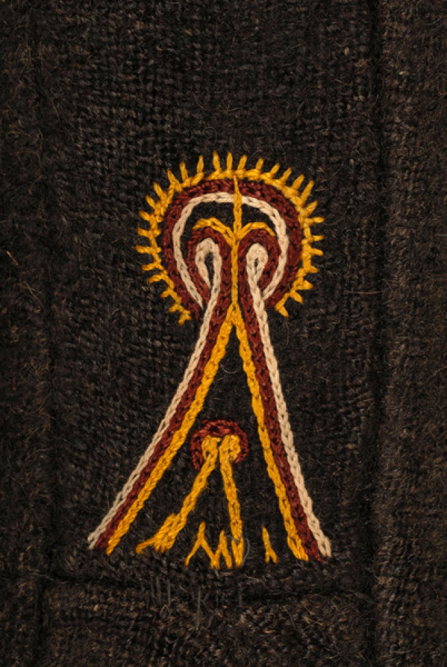 Detail of the decoration at the side, embroidered stylized motif